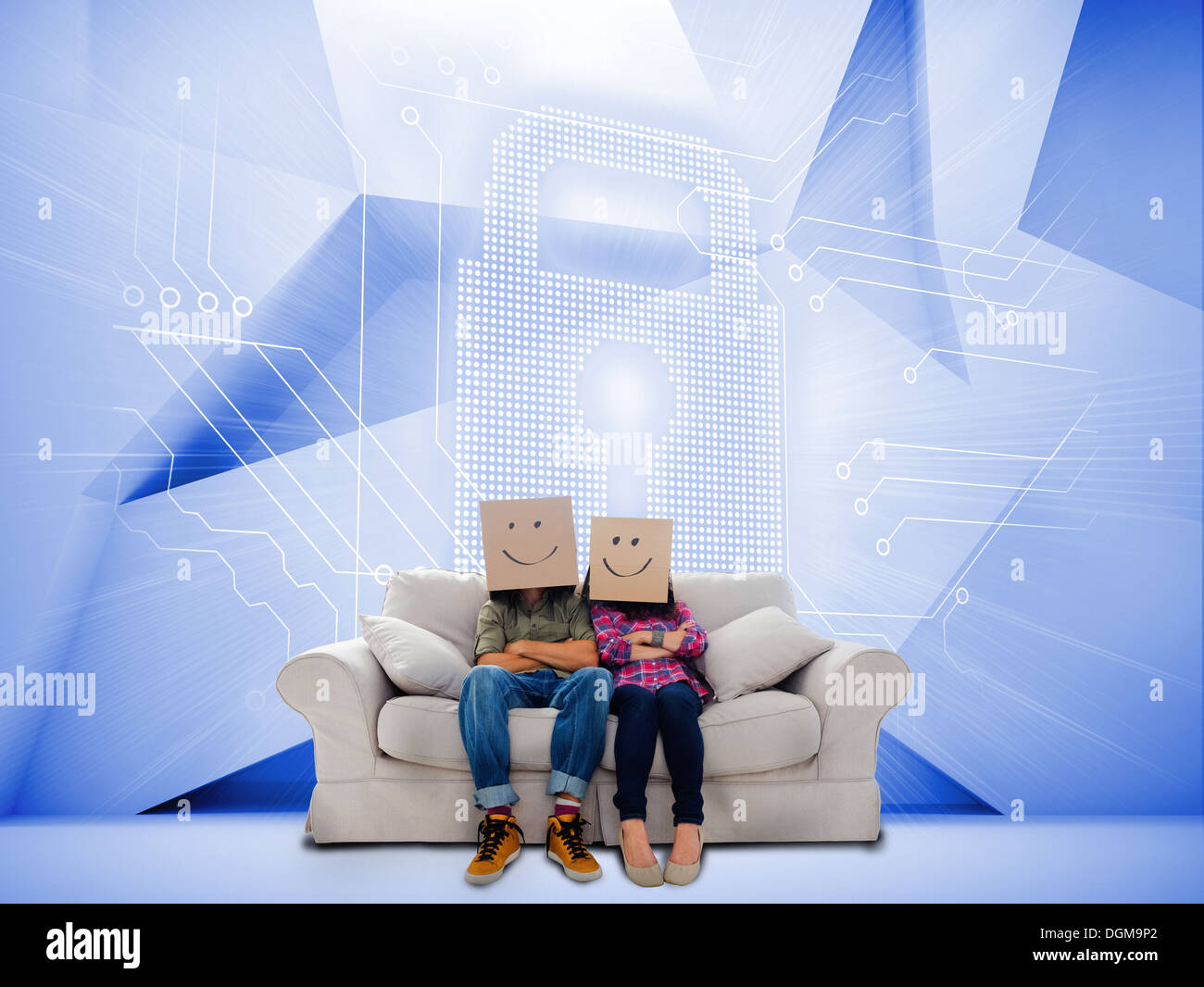 Couple with cartons on head sitting on couch under white holographic lock Stock Photo
