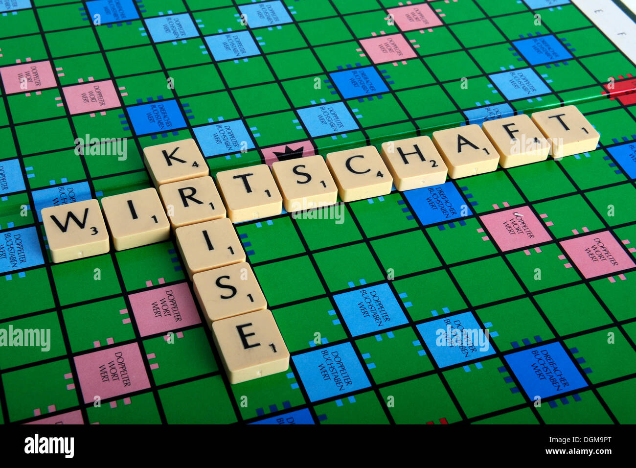 Scrabble letters forming the words Wirtschaft and Krise, German for economic crisis Stock Photo