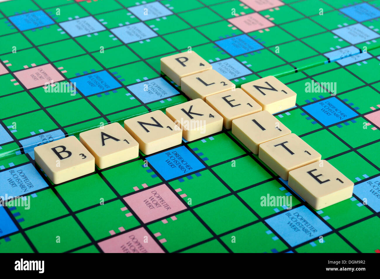 Scrabble letters forming the words Banken and pleite, German for the failure of banks Stock Photo