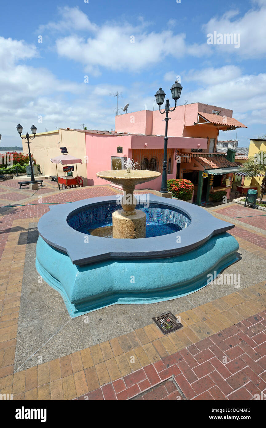 Fountain in front of colourful houses in the district of Las Penas, on Cerro Santa Ana, Guayaquil, Ecuador, South America Stock Photo