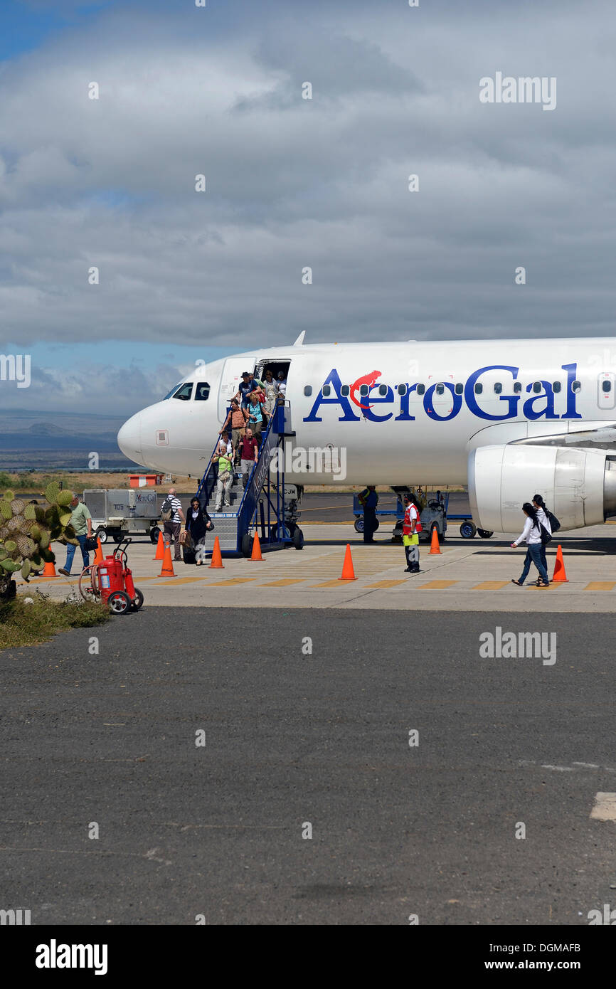 Tourists getting off a plane from AeroGal Airlines at Baltra Island Airport, Galapagos, Ecuador, South America Stock Photo