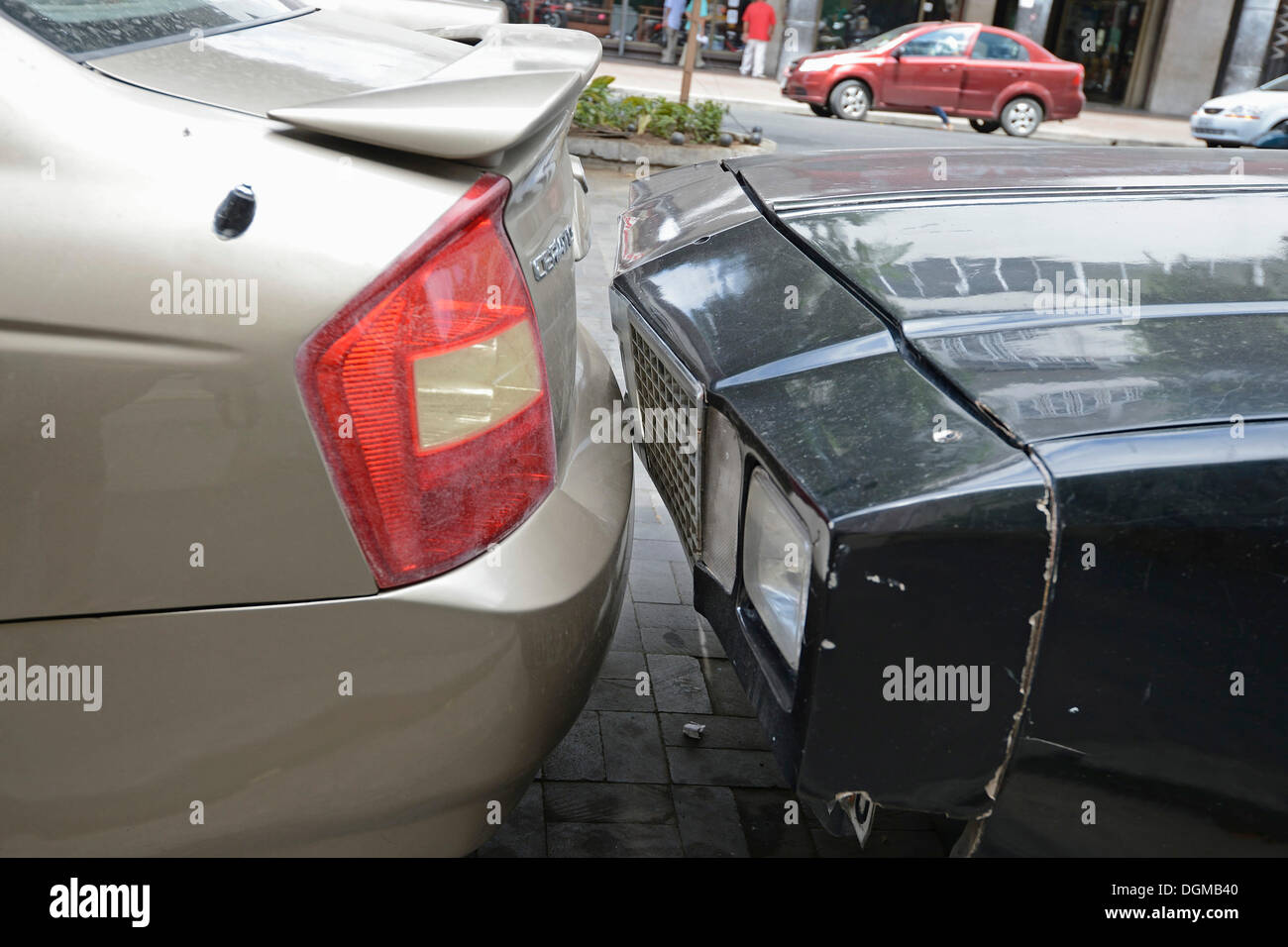 Cars parked bumper to bumper, usual parking in the old town of Guayaquil, Ecuador, South America Stock Photo