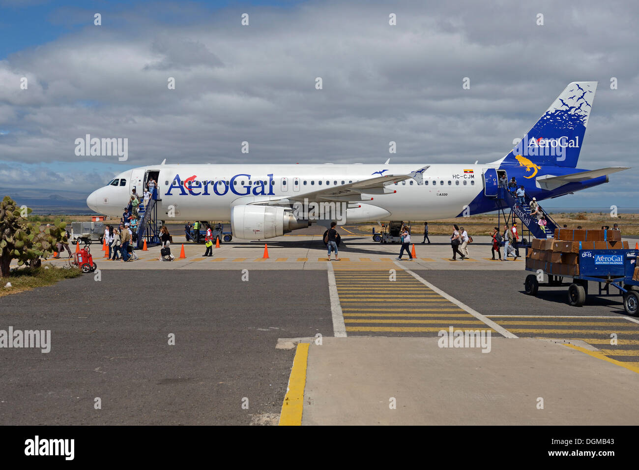 Tourists getting off a plane of AeroGal airlines at Baltra airport island, Galapagos, Ecuador, South America Stock Photo