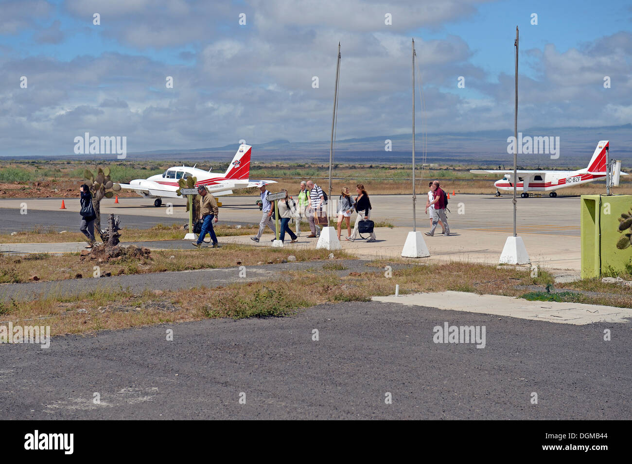 Tourists getting of a plane of AeroGal airlines at Baltra airport island, Galapagos, Ecuador, South America Stock Photo