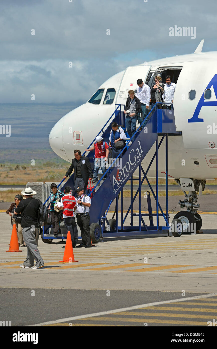 Tourists getting off a plane of AeroGal airlines at Baltra airport island, Galapagos, Ecuador, South America Stock Photo