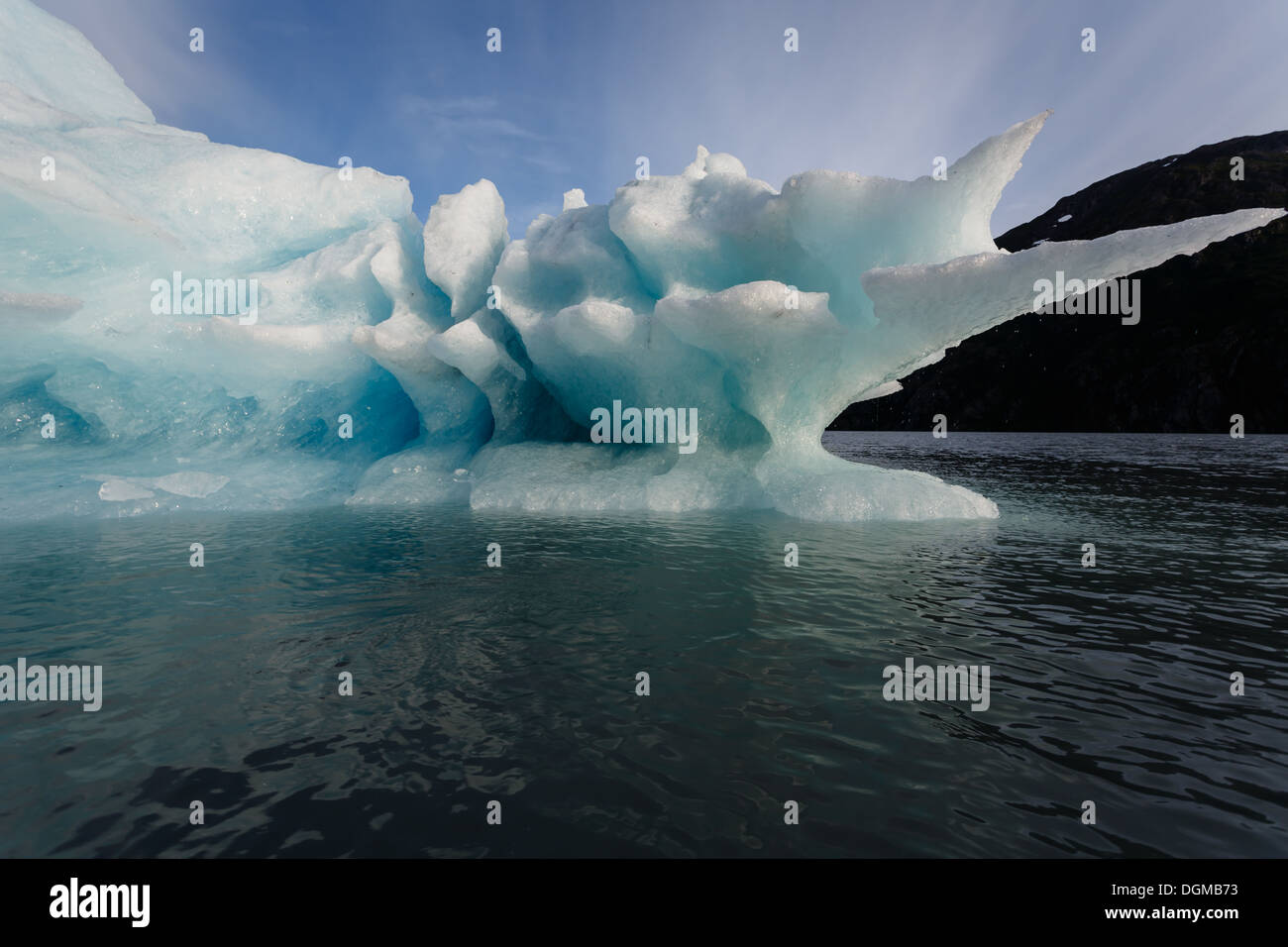 Melting iceberg creates fantastic whimsical swordfish or viking ship shape Stock Photo