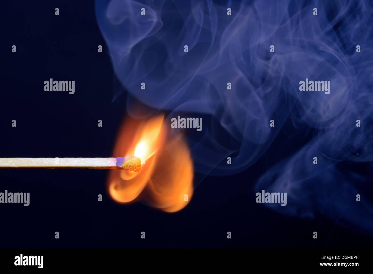Match being lit, blue smoke Stock Photo Alamy