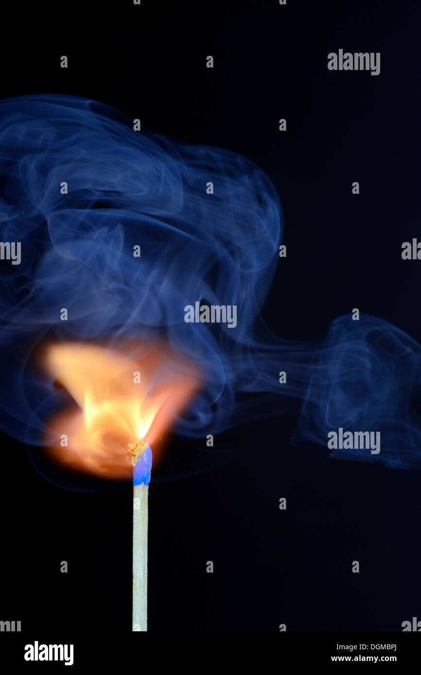 Match being lit, blue smoke Stock Photo Alamy