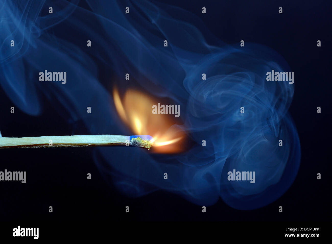 Match being lit, blue smoke Stock Photo Alamy
