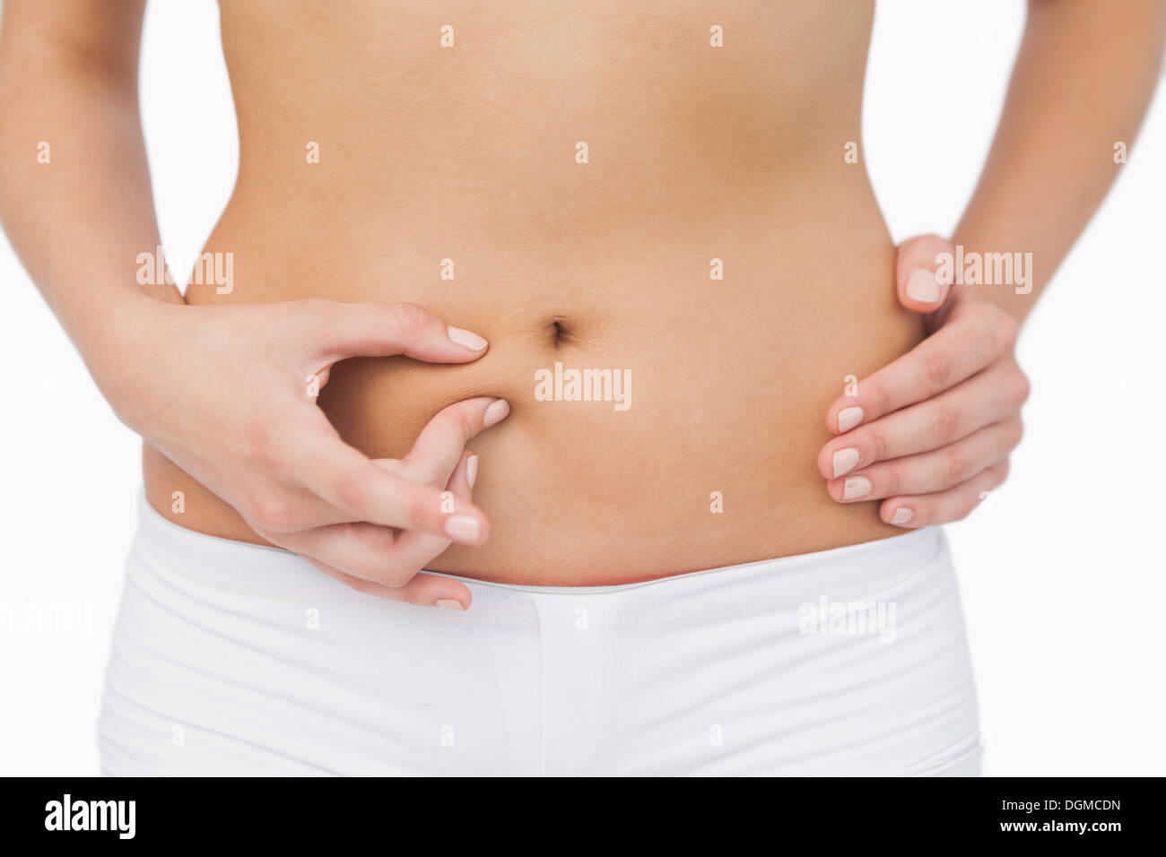 Young woman without any fat on her belly Stock Photo