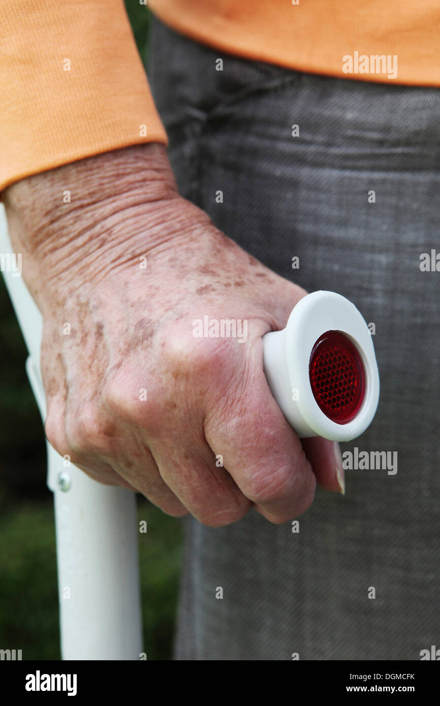 Hand a senior citizen with crutch Stock Photo