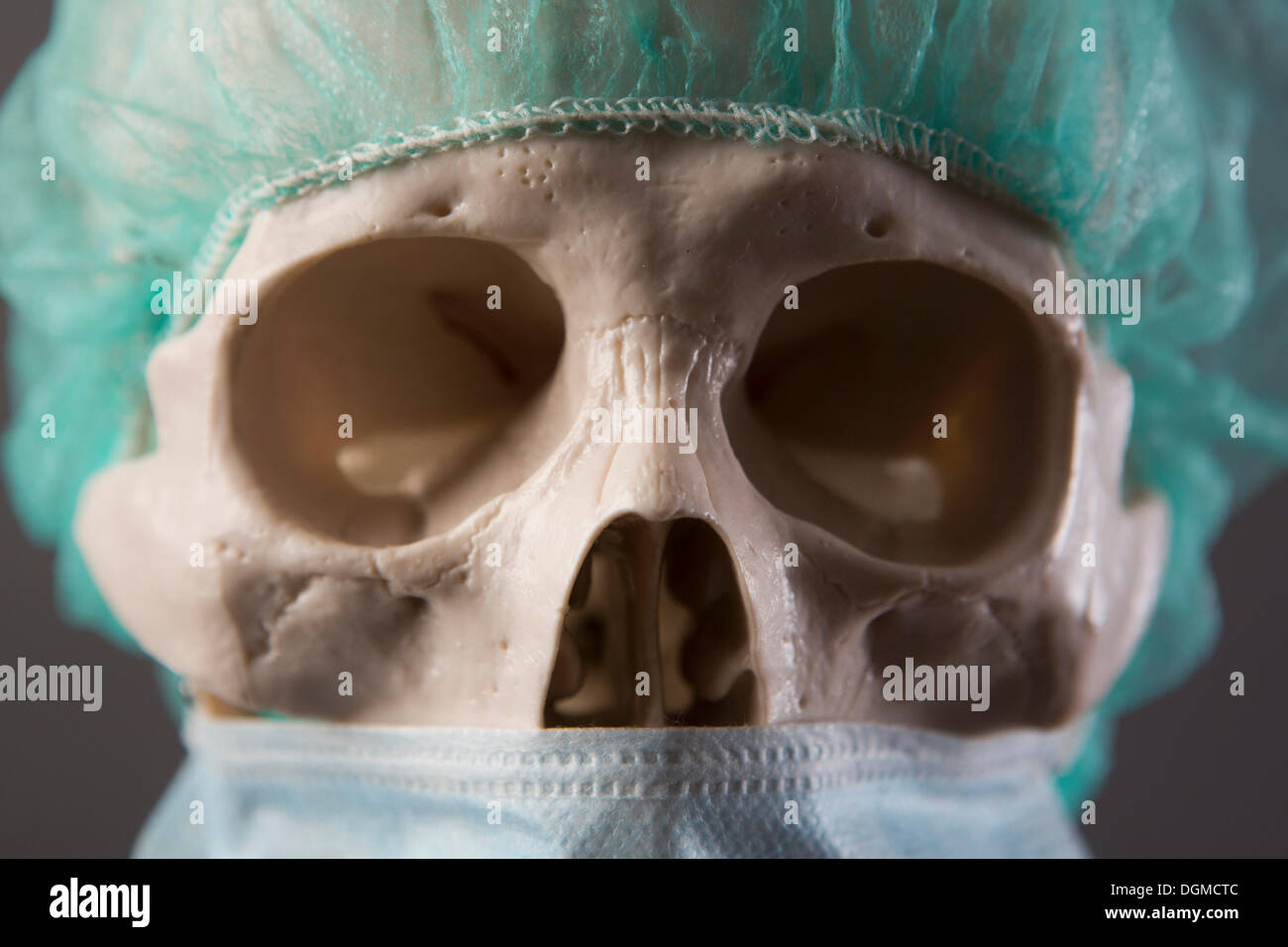 Skeleton dressed as a doctor with surgical mask and cap, portrait, Germany Stock Photo