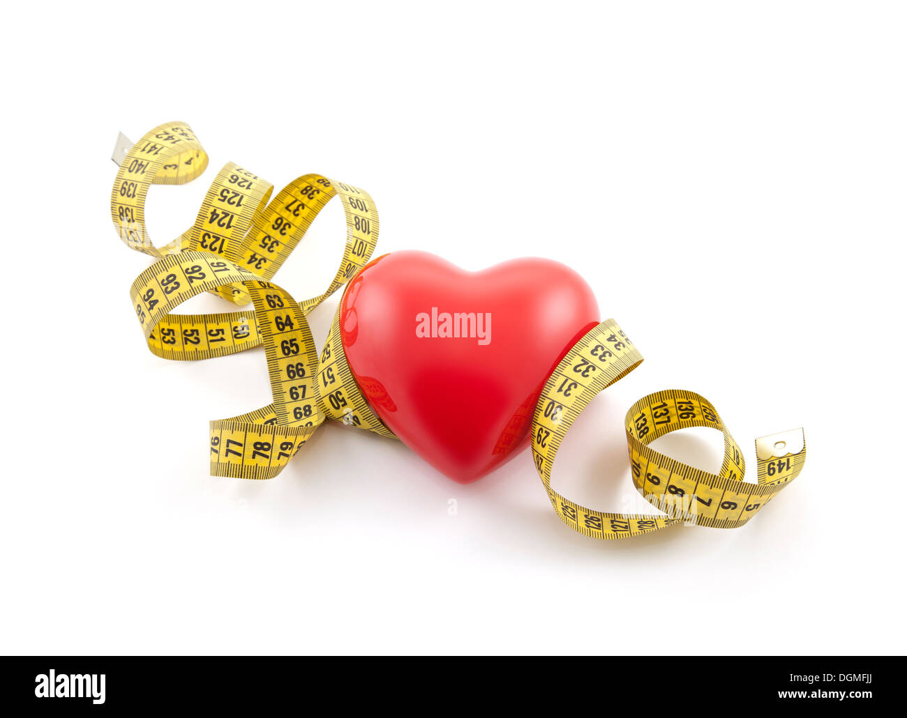 Red heart with yellow tape measure. Clipping path included. Stock Photo
