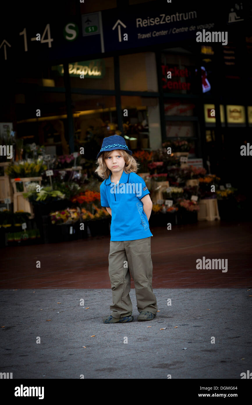 Boy, 4, wearing a hat, looking dissatisfied Stock Photo