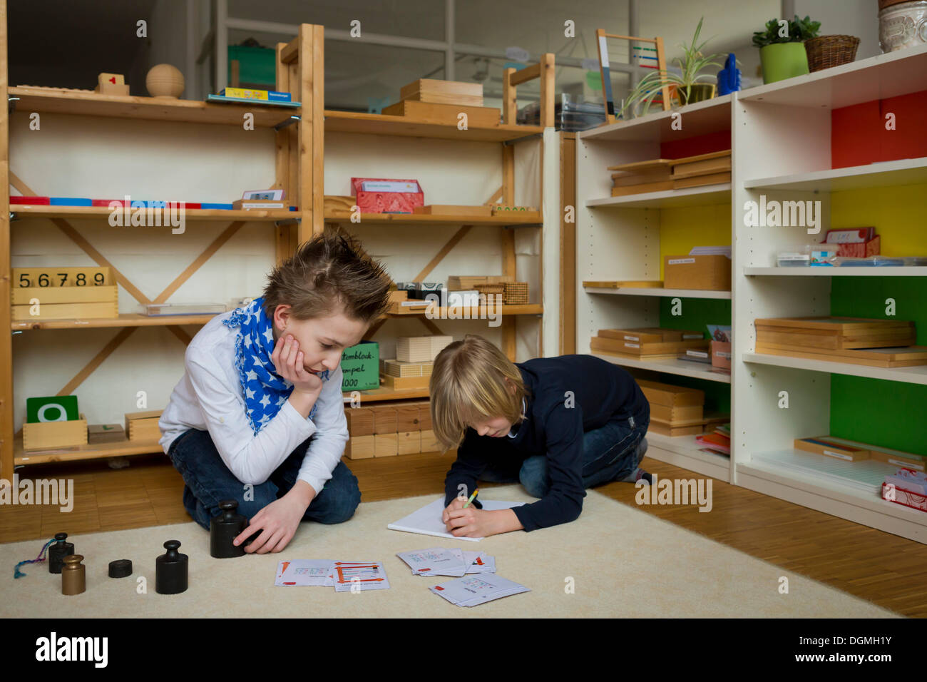 Two students at an independant school, working with the materials, Aktive Schule Peterhausen, Petershausen, Upper Bavaria Stock Photo