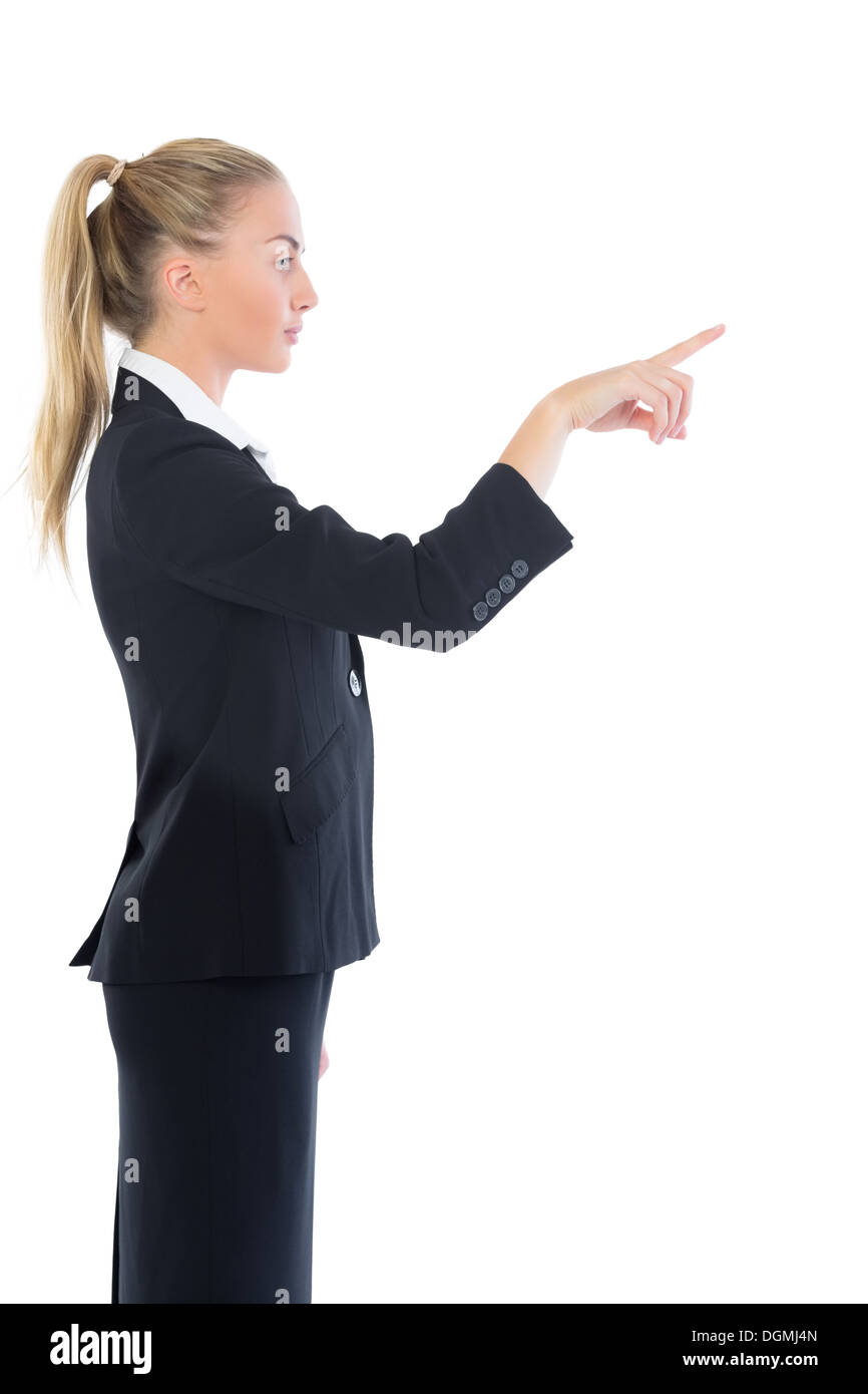 Profile view of attractive blonde businesswoman pointing Stock Photo
