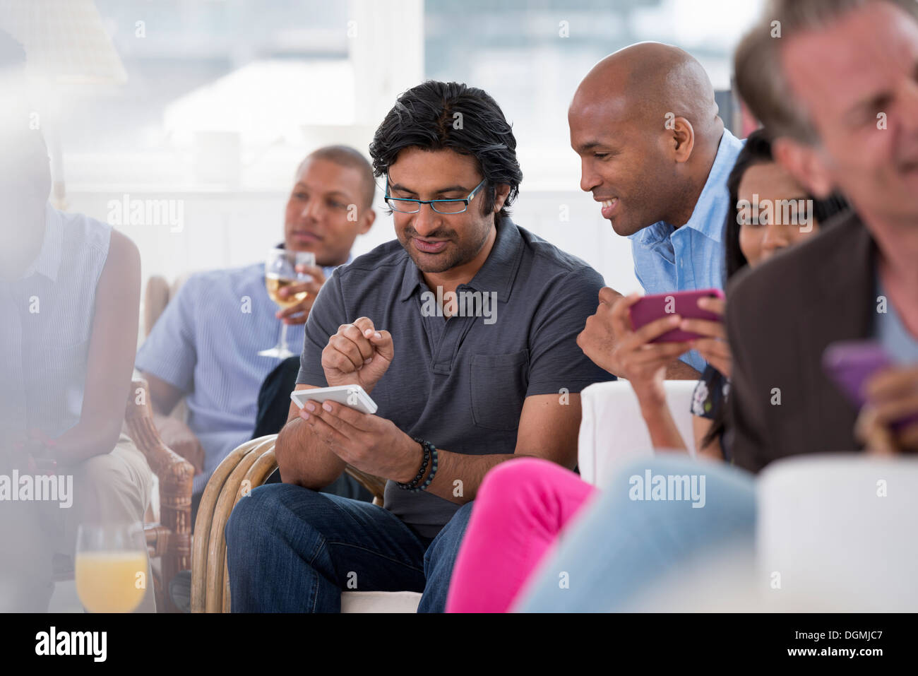 office event. A woman checking her smart phone. Stock Photo