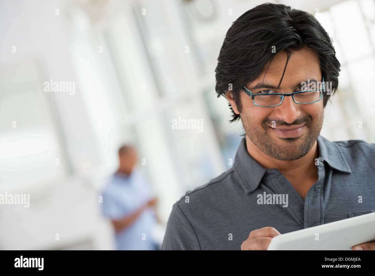 Business people. A man using a digital tablet. Stock Photo