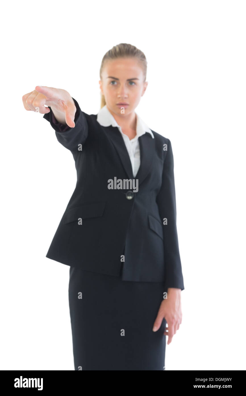 Focused young businesswoman pointing Stock Photo