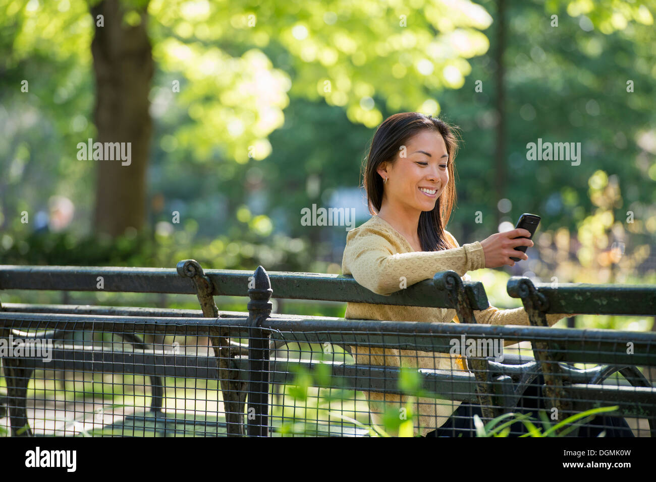 A businesswoman and two businessmen outdoors in the city. Stock Photo