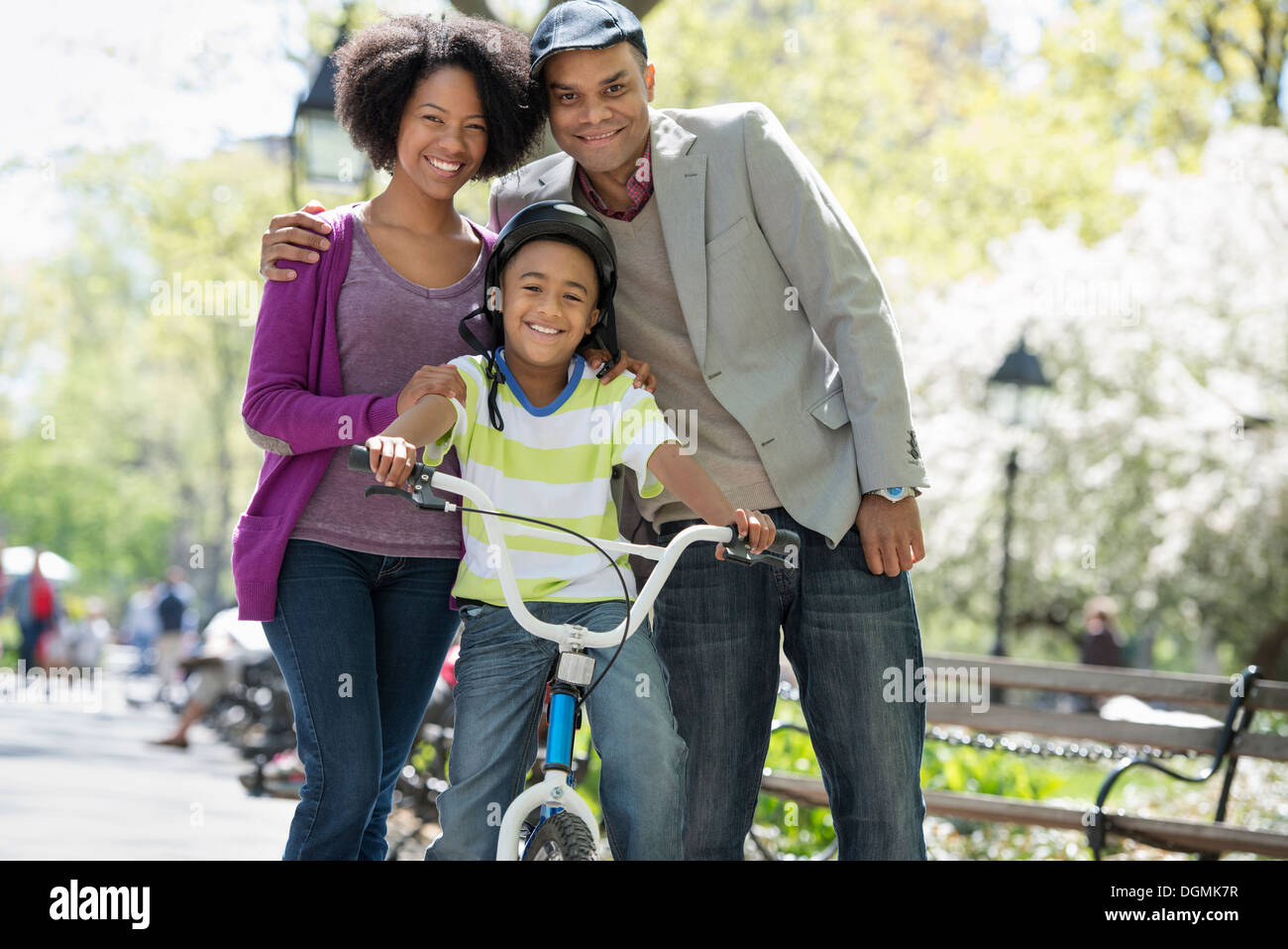 A family in the park on a sunny day Stock Photo - Alamy