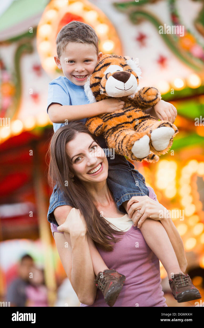 Portrait of young mother giving her son a piggyback ride, Stock Photo,  Picture And Royalty Free Image. Pic. WES-DGOF00925