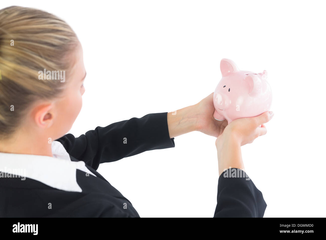 Blonde cute businesswoman holding a piggy bank Stock Photo - Alamy