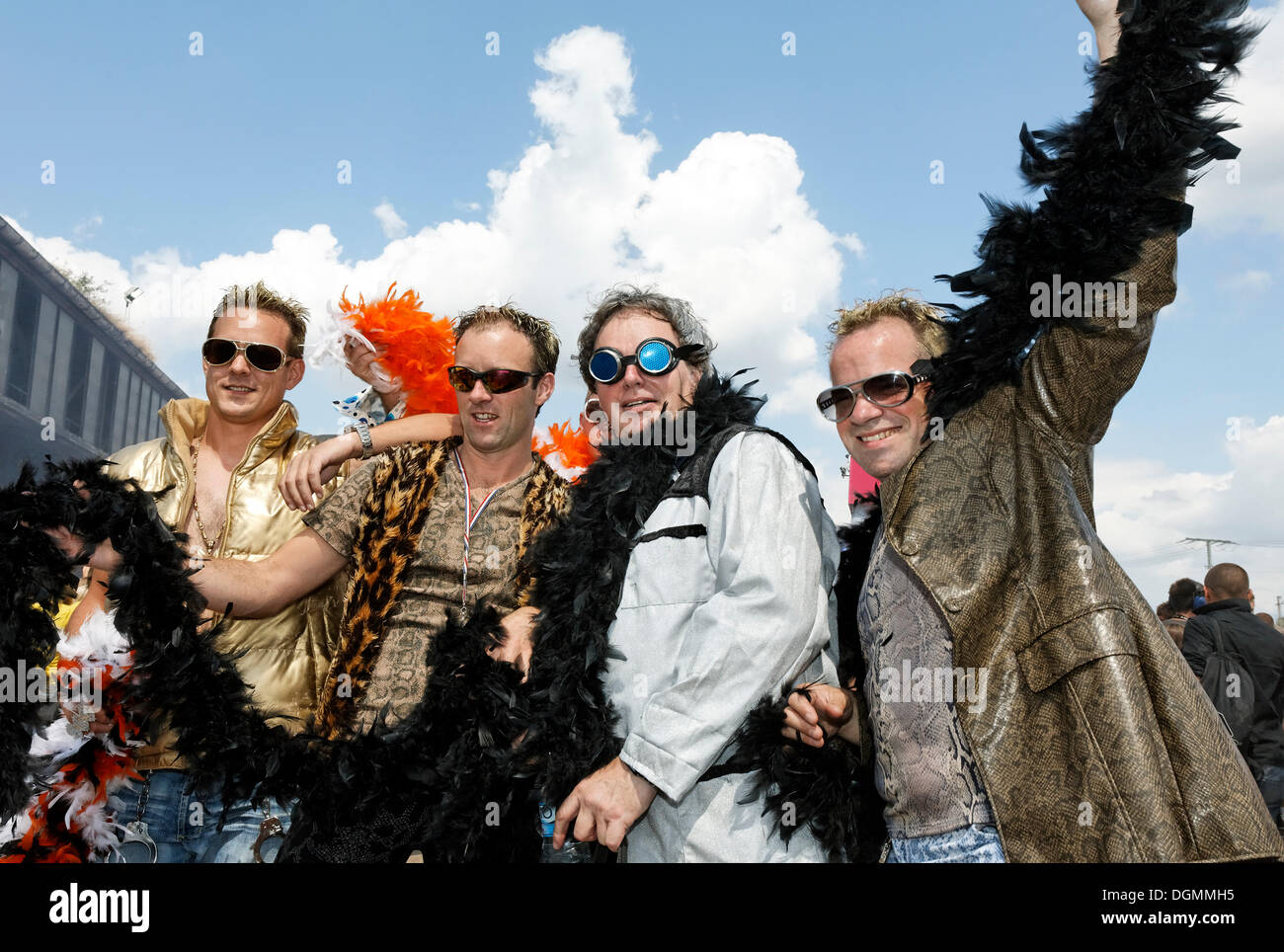 Four ravers wearing feather boas, Loveparade 2010, Duisburg, North Rhine-Westfalia Stock Photo
