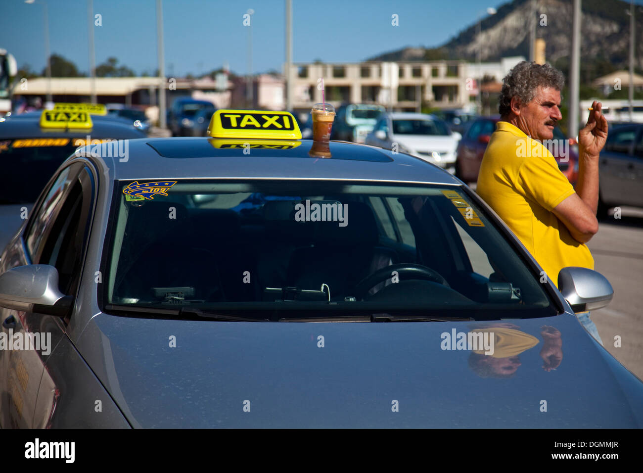 Greek Taxi Driver Waiting Outside The Arrivals Hall, Zakynthos (Zante