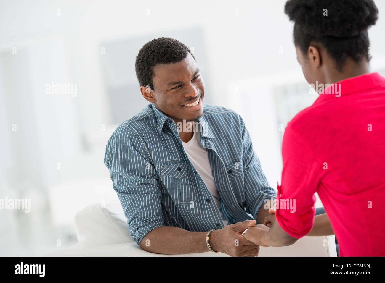 Office interior. Two people talking to each other, face to face. Stock Photo