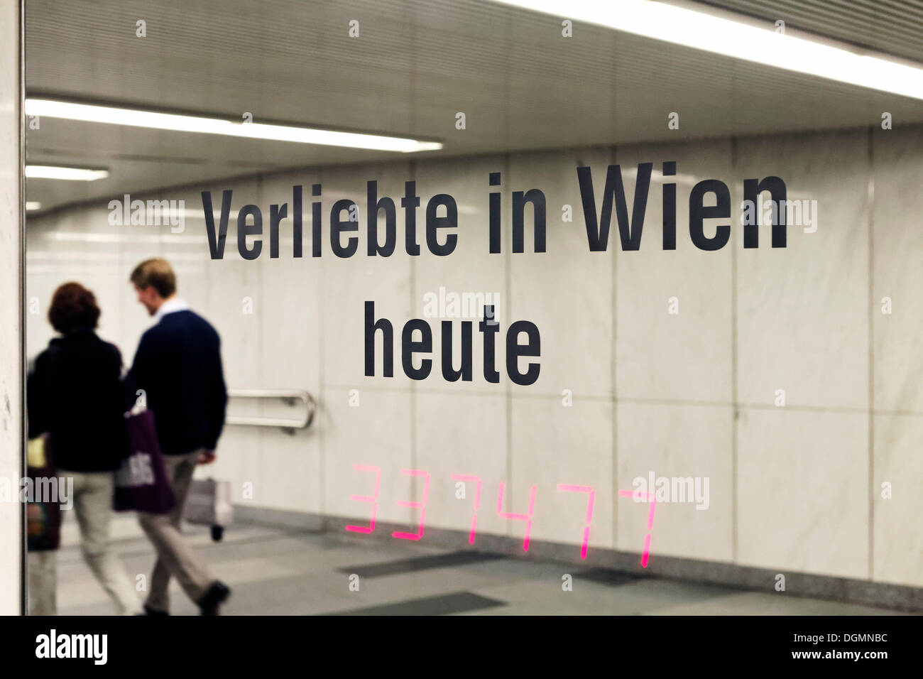'Verliebte in Wien heute', German for 'Lovers in Vienna Today', media installation by Ken Lum, Westpassage Karlsplatz square Stock Photo