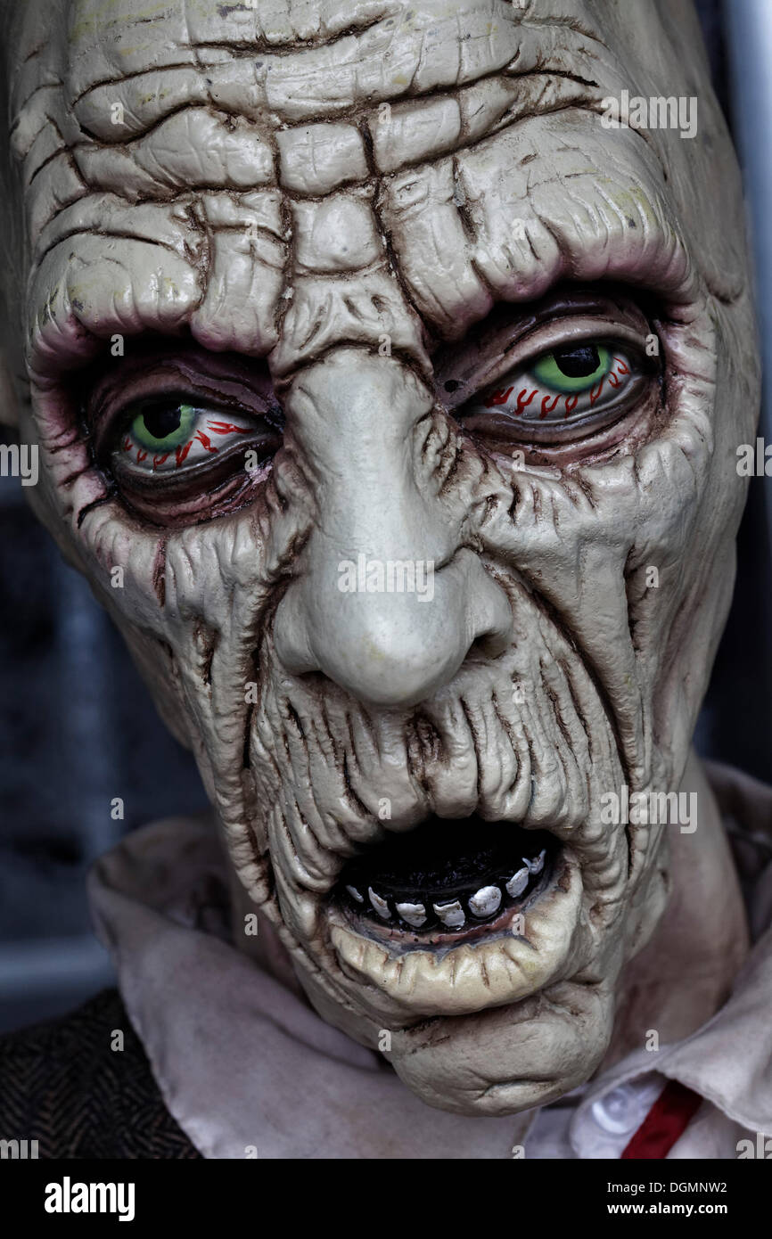 Desperate face, bloodshot eyes, open mouth, haunted house figure Stock Photo