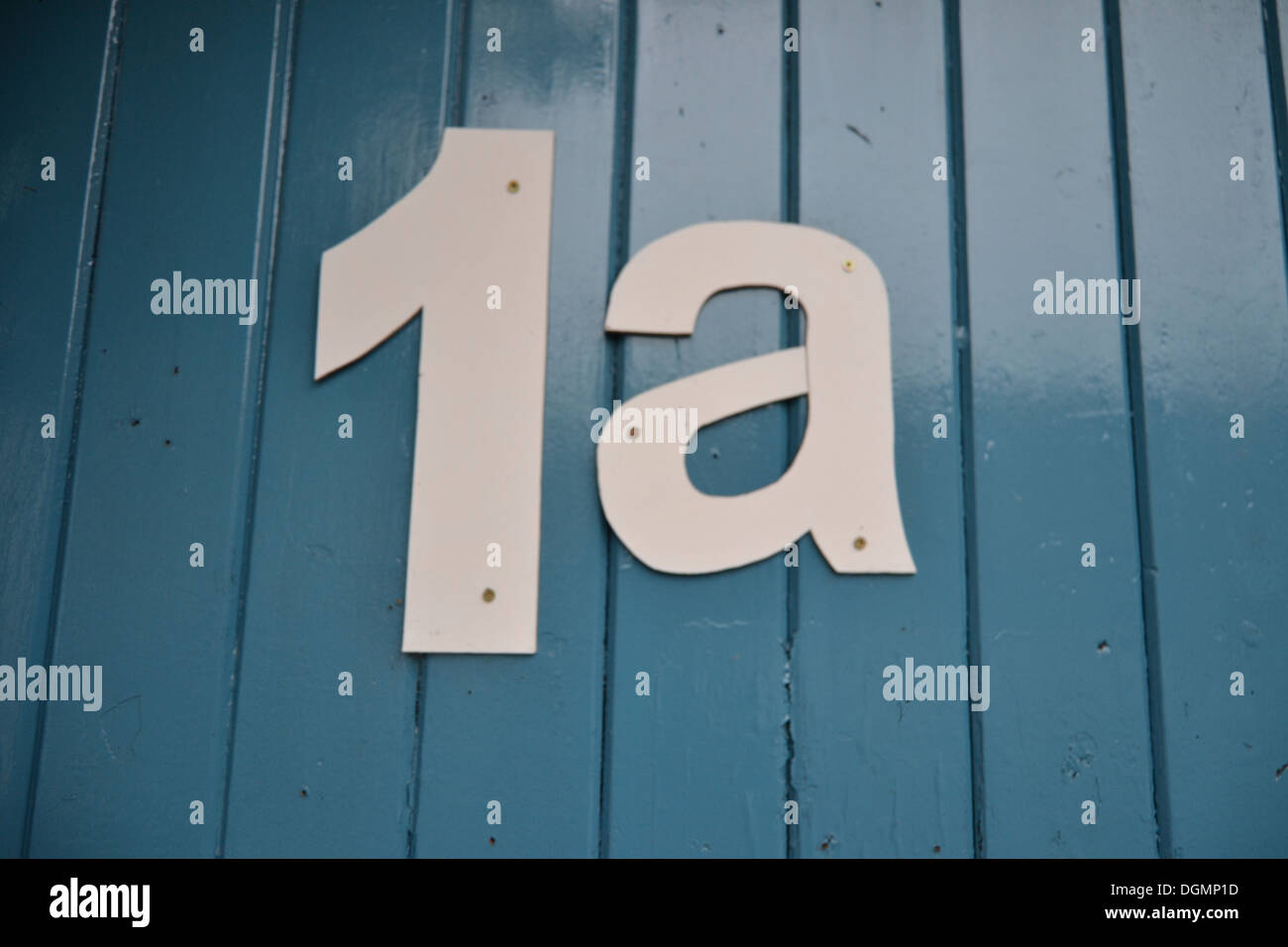 The Number One A with a blue wooden background Stock Photo - Alamy