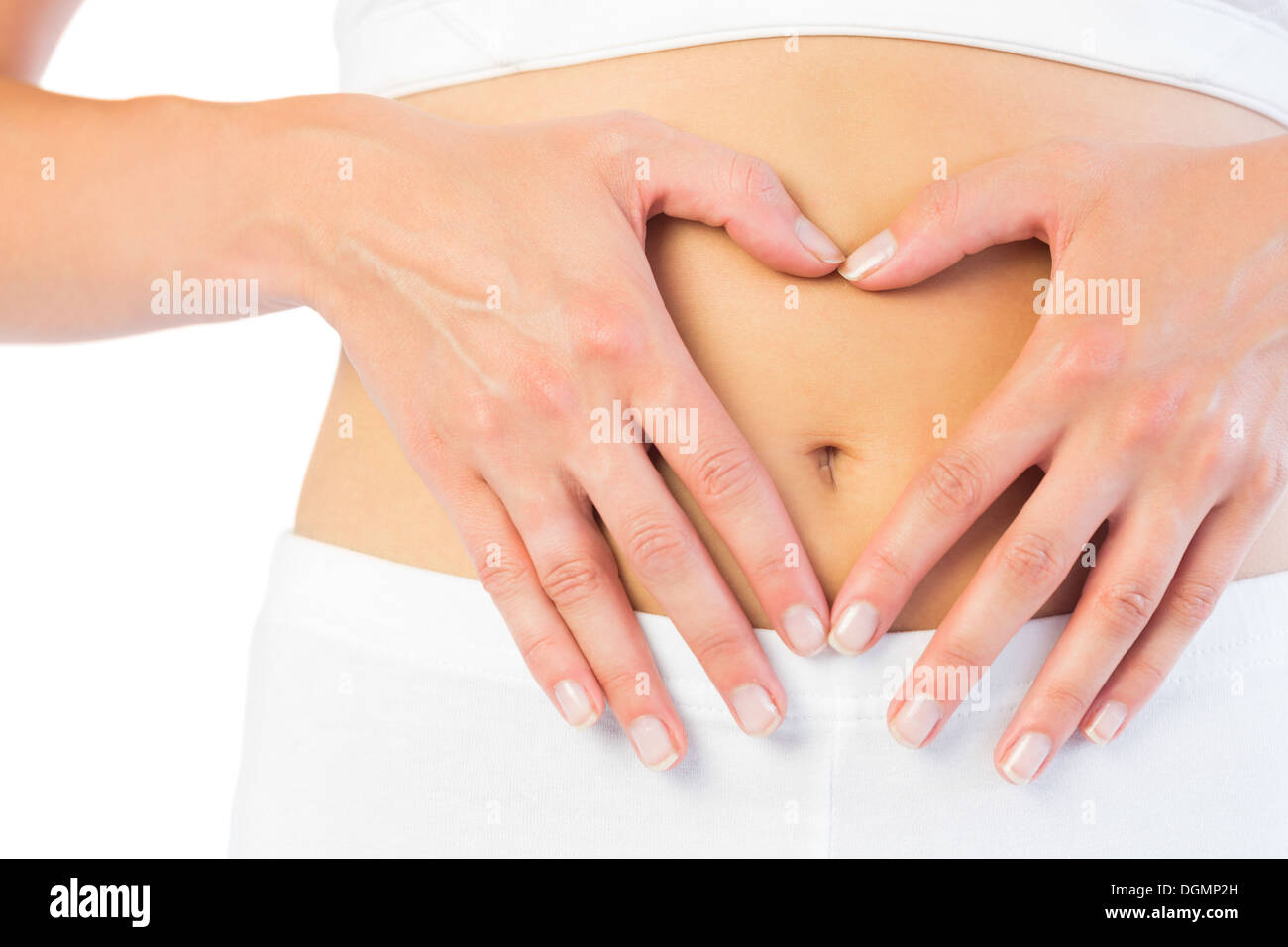 Close up picture of fit woman holding her belly Stock Photo