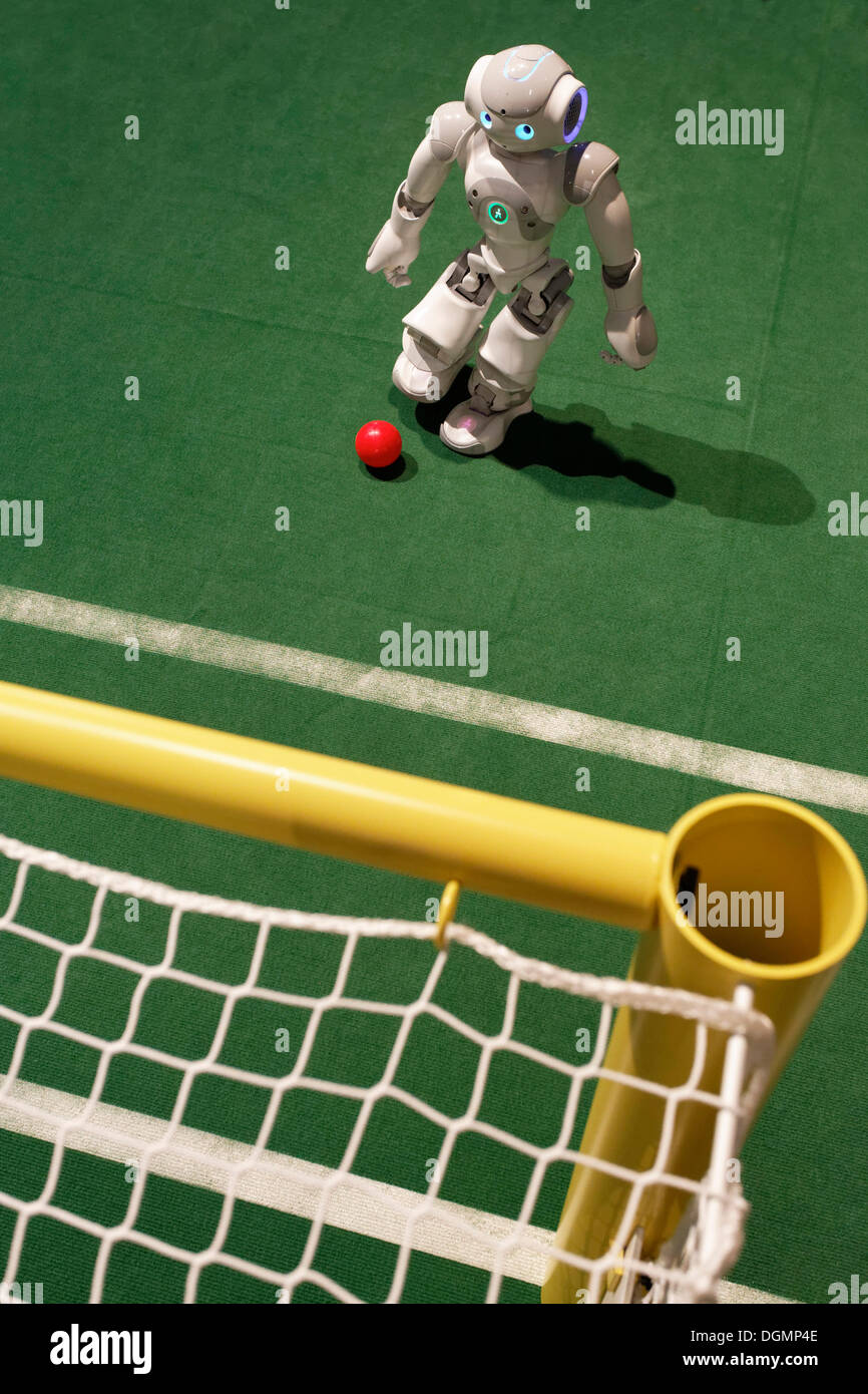 NAO kicking a ball into a goal, a humanoid robot from Aldebaran Robotics, IdeenPark 2012, technology and education summit Stock Photo