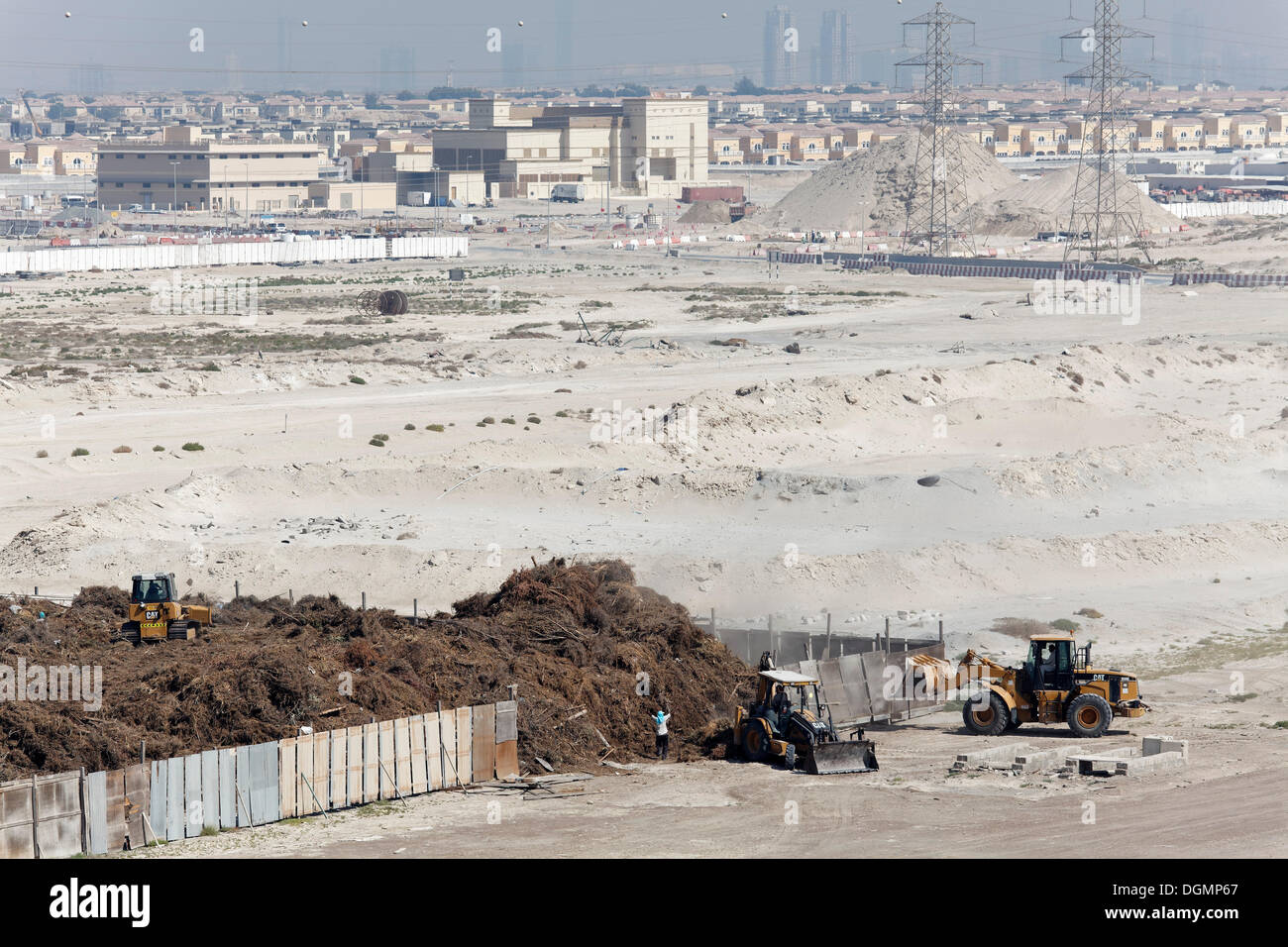 Barren land with electricity transmission pylons, urban development area, Nakheel Harbour, Dubai, United Arab Emirates Stock Photo