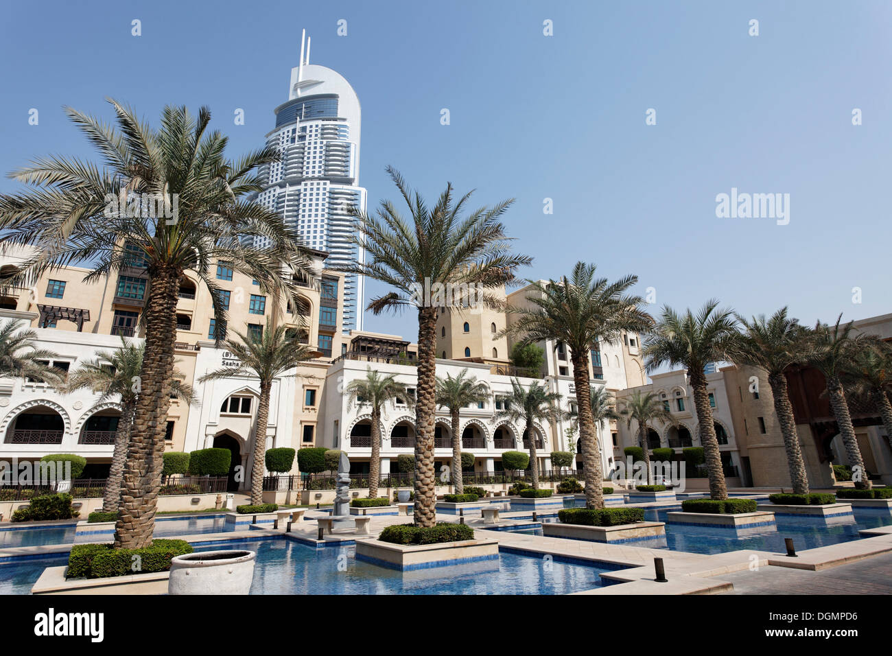 District built in the traditional style, Downtown Dubai, The Old Town, in front of a skyscraper, The Address, a luxury hotel Stock Photo