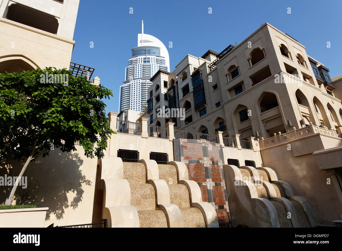 District built in the traditional style, Downtown Dubai, The Old Town, in front of a skyscraper, The Address, a luxury hotel Stock Photo