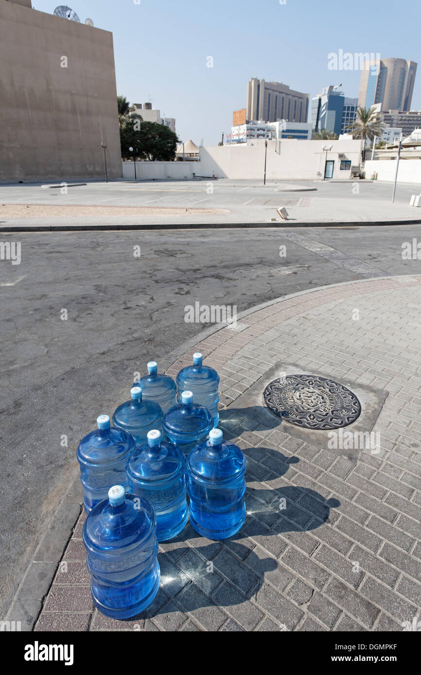 https://c8.alamy.com/comp/DGMPKF/gallons-of-water-for-a-water-dispenser-placed-on-the-roadside-dubai-DGMPKF.jpg