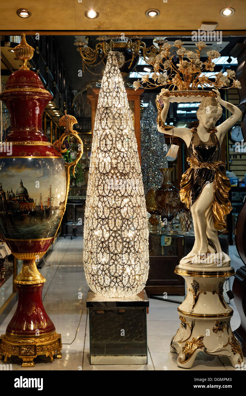 Monumental amphora, a floor lamp and a sculptural figure, kitsch decor in a European style for Arab home furnishings, Deira Stock Photo