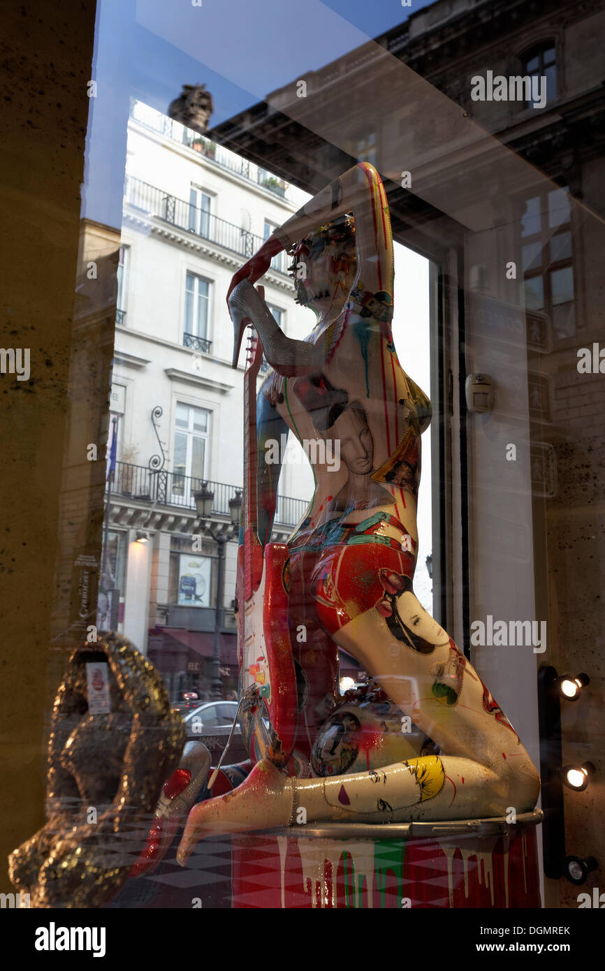 Painted shop-window mannequin in the shop window of an art gallery, Rue Rivoli street, 1st arrondissement, Paris, Ile-de-France Stock Photo