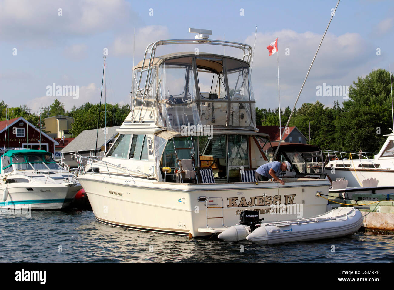 Boats at dock, Bras d'Or Lake, Baddeck, Cape Breton, Nova Scotia, Canada Stock Photo