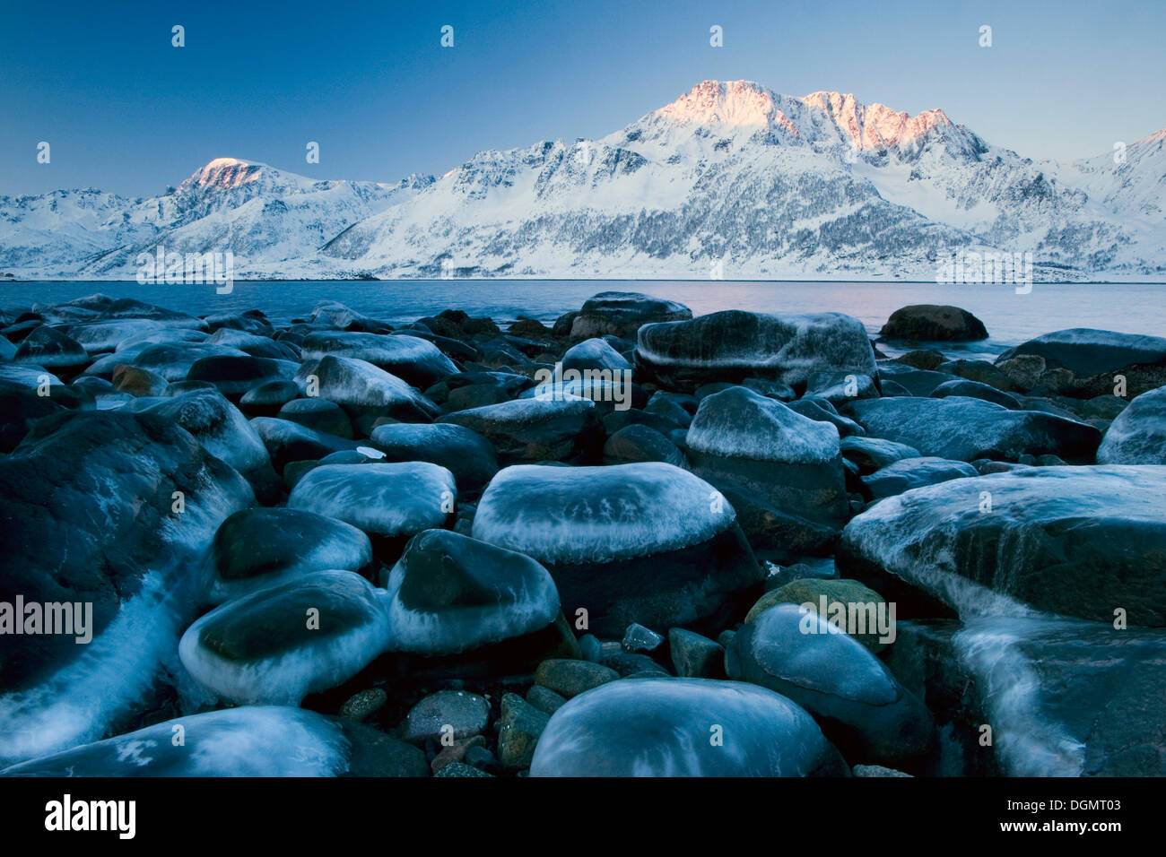 Ice-capped rocks on the coast of Nuvsfjorden Nuvsfjord, Finnmark, Norway, Europe Stock Photo