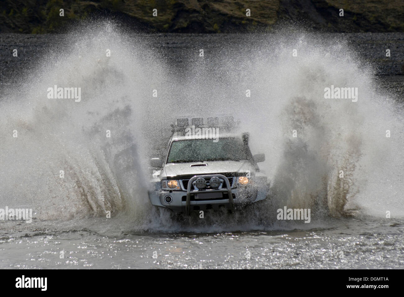 Super jeep driving through a tributary of the Krossá River, Þórsmoerk, Iceland, Europe Stock Photo