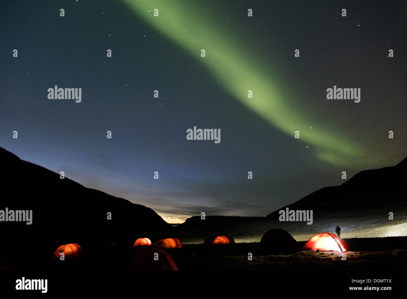 Green nothern lights, aurora borealis, above a tent camp in Bjørndalen, Spitsbergen, Svalbard, Norway, Scandinavia, Europe Stock Photo