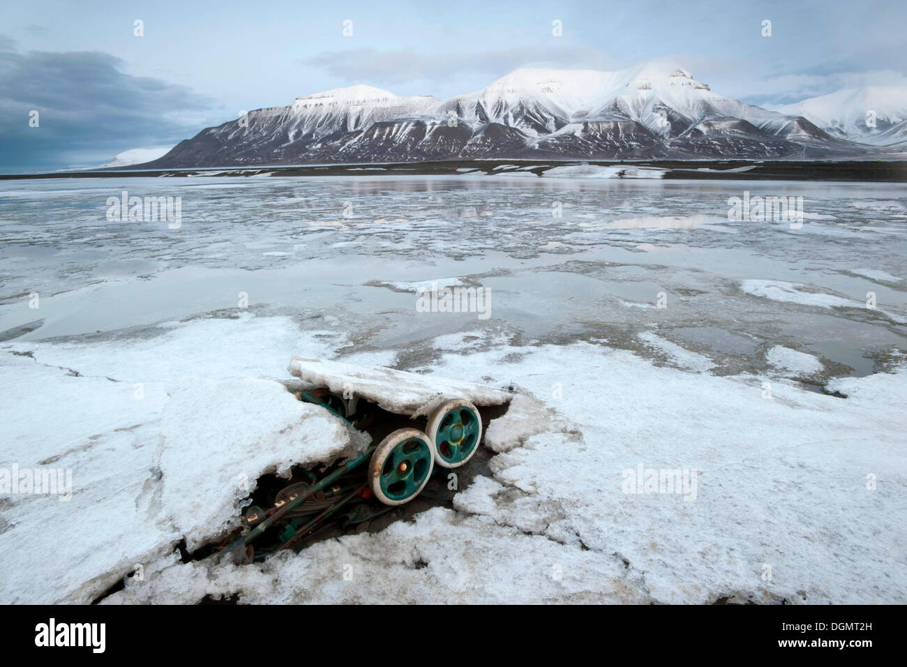 A discarded pram, waste on the coast of the Adventfjorden bay, Longyearbyen, Spitsbergen, Svalbard, Norway, Europe Stock Photo