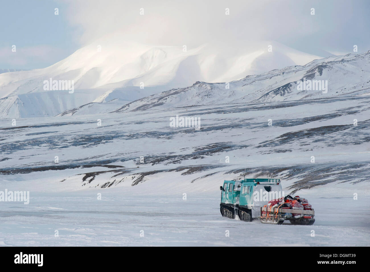 Beltwagon, tracked vehicle, transporting passengers and luggage on a snowmobile track, Adventdalen, Spitsbergen, Svalbard Stock Photo