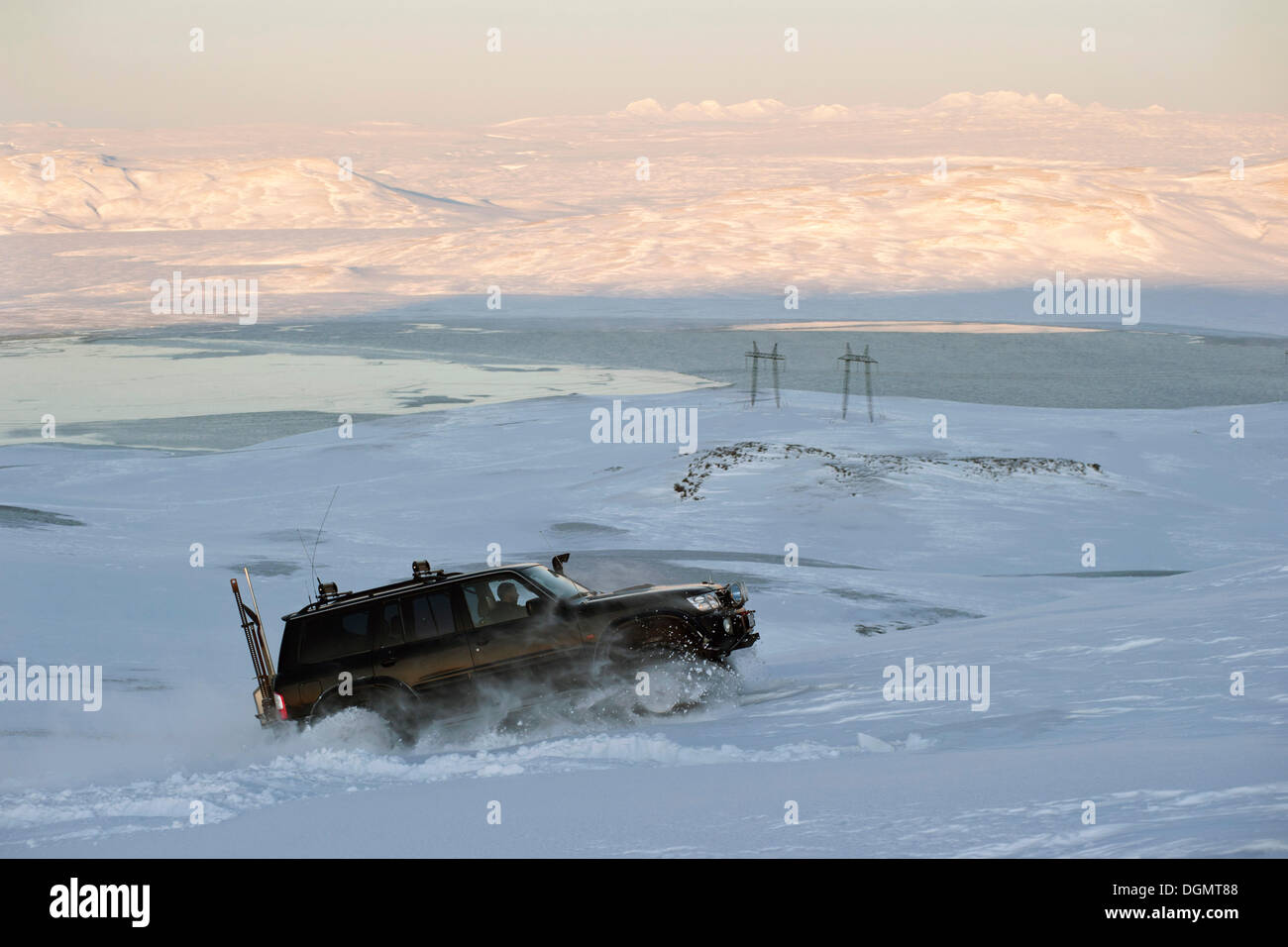 Super Jeep driving at full throttle up a steep snowy slope, Hrauneyjar, Iceland, Europe Stock Photo