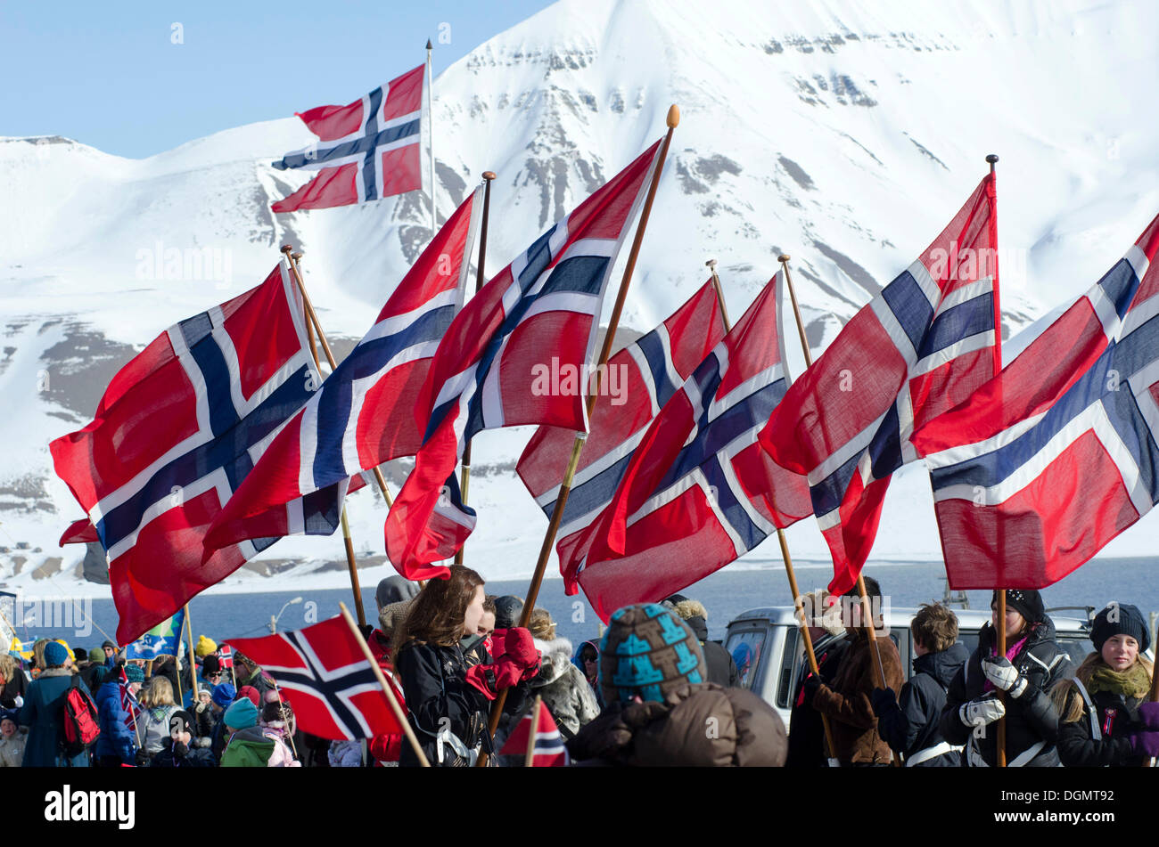 Norwegian national flags on Norwegian National Day, 17th May, being carried through Longyearbyen, Spitsbergen, Svalbard, Norway Stock Photo