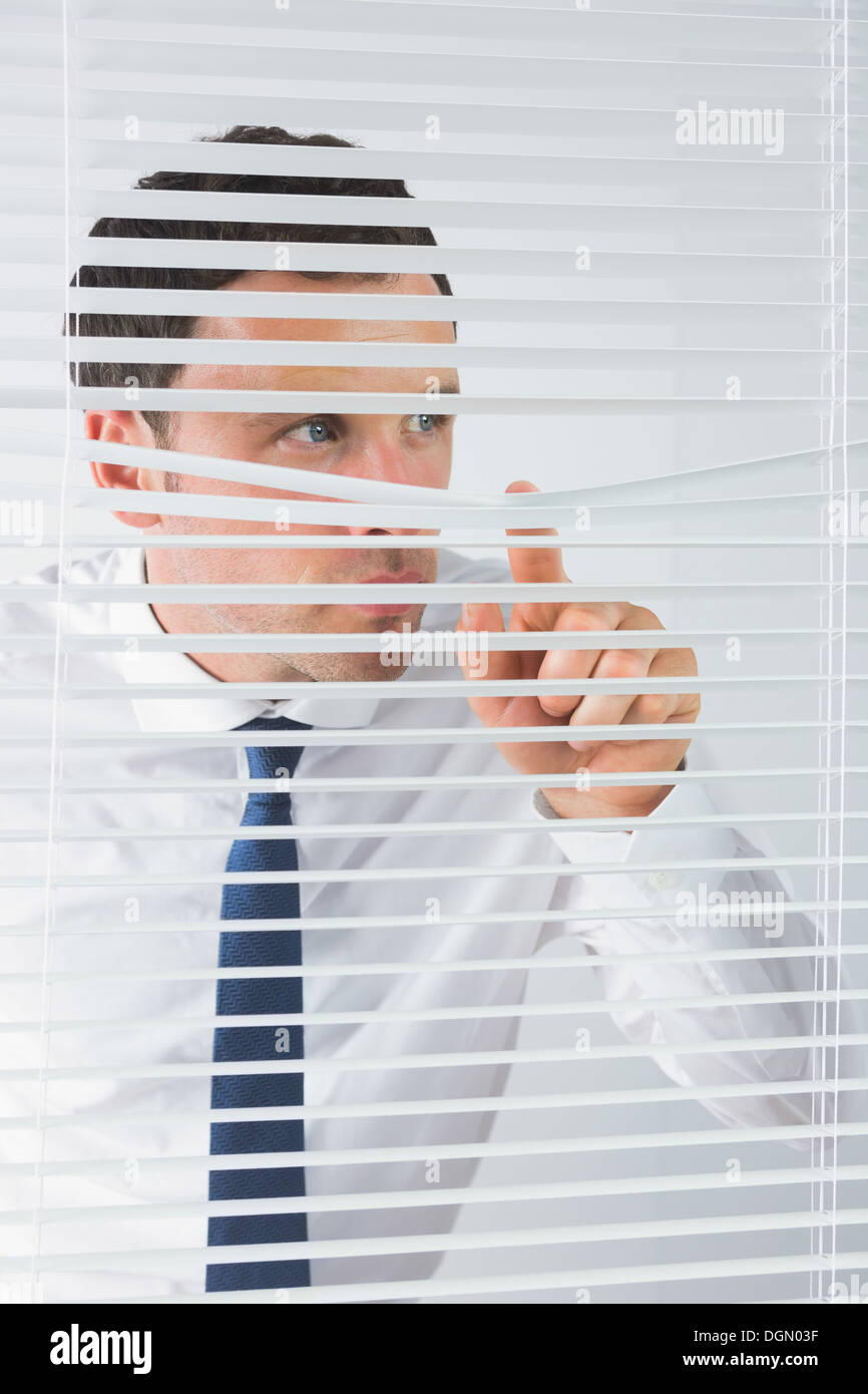 Good looking businessman spying Stock Photo